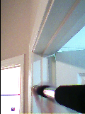 image captured from poor-quality camera showing pull-up bar