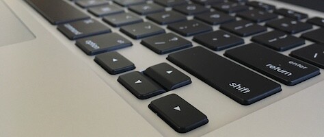 2015 macbook pro keyboard with taller keys and inverted 'T' arrow keys