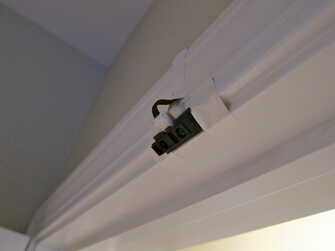 sensor mounted to door frame above pull-up bar