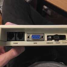 rear of apple modem case showing various ports
